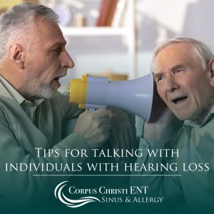 Man using a bullhorn to talk to someone with hearing loss